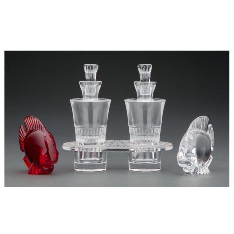 A Lalique Clear and Frosted Glass Bourgueil Cruet Set with Two Daum Glass Fish, designed 1933
