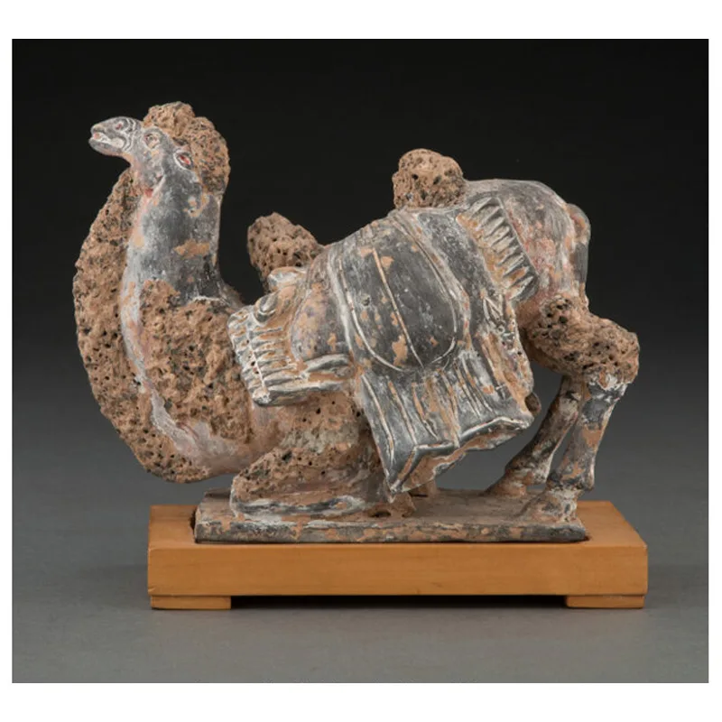 A Chinese Grey Pottery Figure of a Recumbent Camel, Northern Wei Dynasty