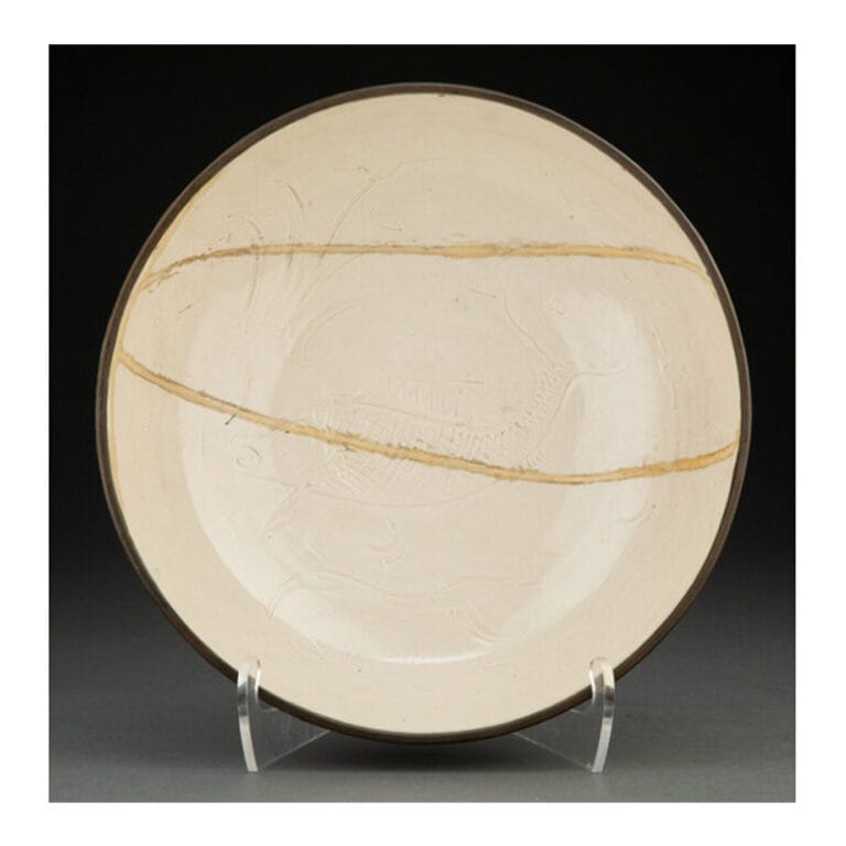 A Rare and Large Carved Dingyao Deep Bowl with Metal Rim, Song Dynasty