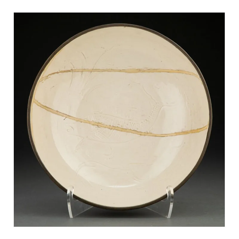 A Rare and Large Carved Dingyao Deep Bowl with Metal Rim, Song Dynasty